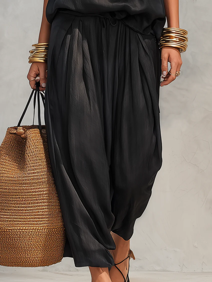 Aurora – Set top senza maniche con collo all'americana e pantaloni plissettati