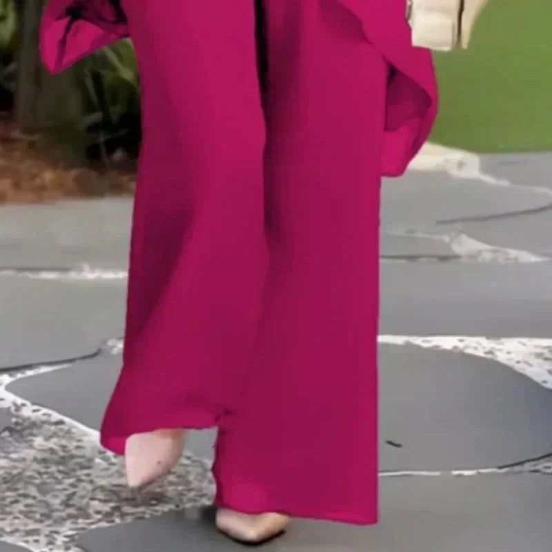 Completo con pantaloni palazzo drappeggiati