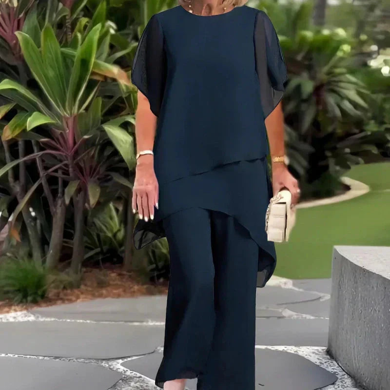 Completo con pantaloni palazzo drappeggiati
