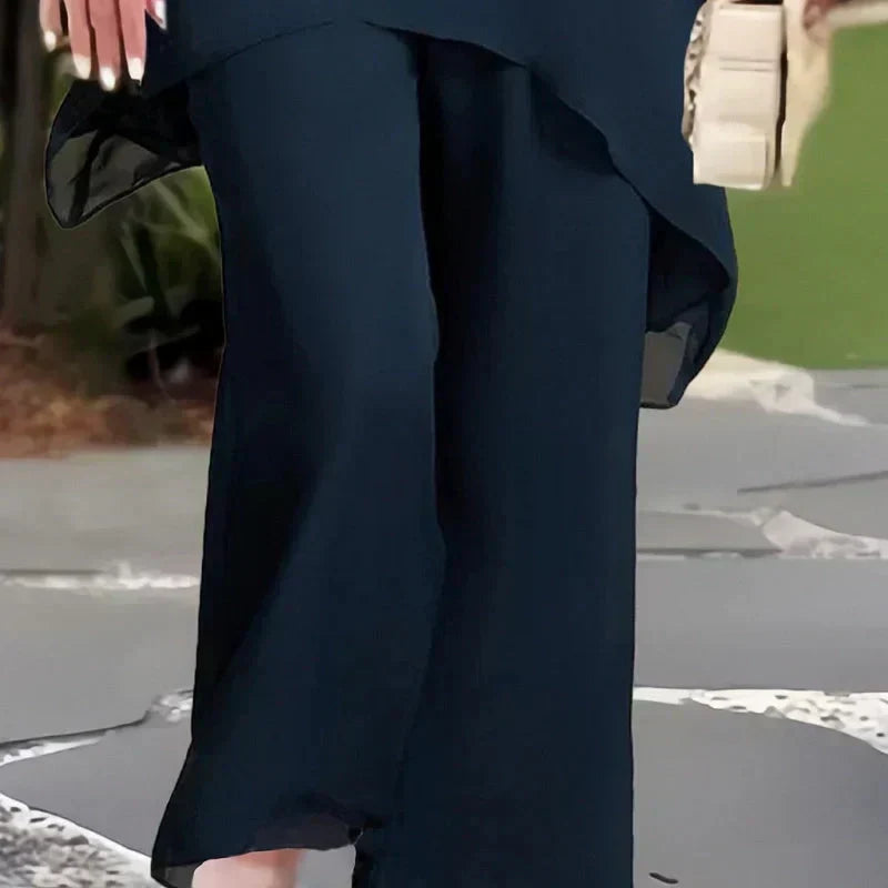 Completo con pantaloni palazzo drappeggiati